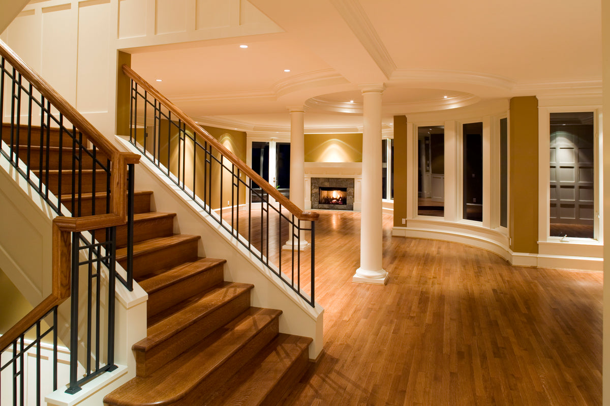 Staircase leading to an upper level in a well-lit home interior.
