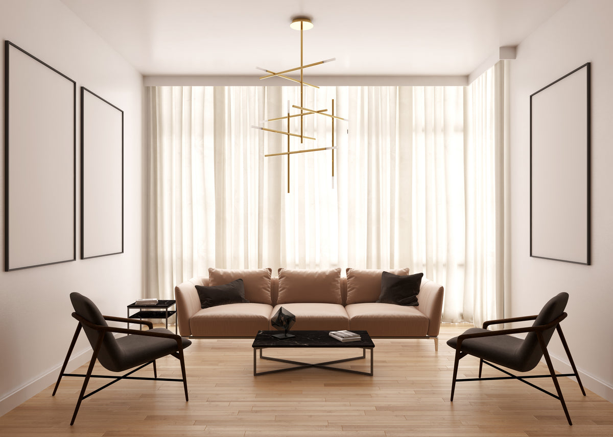 Modern living room with beige sofa, black chairs, and a chandelier.