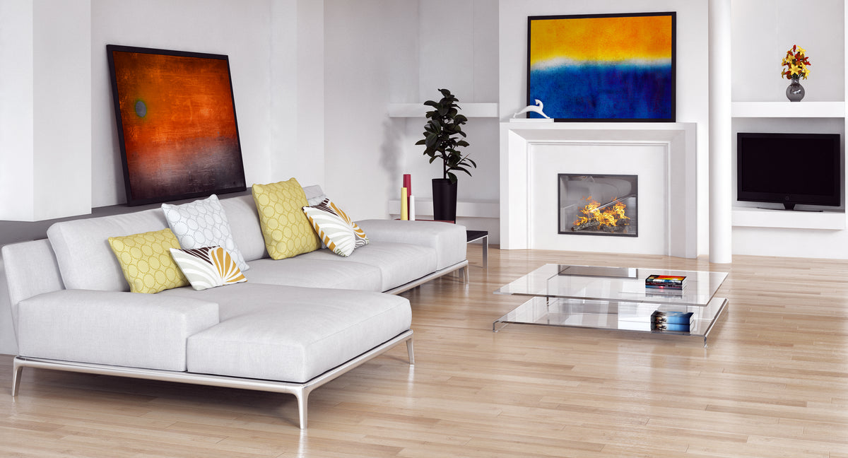 Modern living room with white sofa, fireplace, and abstract art